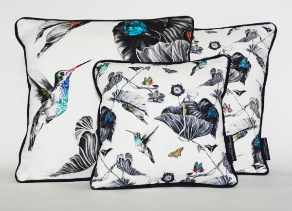 "Multi Hummingbirds" cushions, 2017, by Susannah Weiland. Hand embroidered, one-of-a-kind cushions. Pencil drawing printed onto cotton sateen; color hand-stitched with matte, silk, and metallic fine machine embroidery threads and seed beads; black velvet back and piping. (Susannah Weiland)