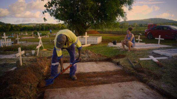 A young couple prepares a grave for concrete at Hope Vale cemetery in Hope Vale, Australia. (Courtesy of Caden Pearson)