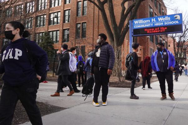 Students leave William Wells High School in Chicago on March 14, 2022. (Scott Olson/Getty Images)