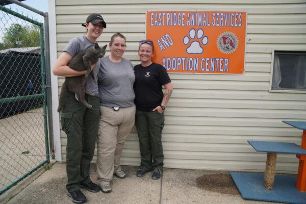 Animal control officers Caroline Smith (left), Leigh Stacy(center), and Crystal Reno (right) pose outside East Ridge Animal Services shelter in East Ridge, Tenn., on April 13, 2022. (Jackson Elliott/ The Epoch Times)