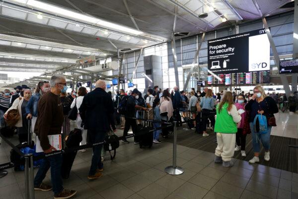 People queue on arrival at Sydney Domestic Airport ahead of the Easter long weekend in Sydney, Australia, on April 14, 2022. (Lisa Maree Williams/Getty Images)