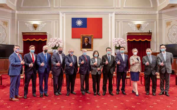 Members of an American congressional delegation pose for a photo with Taiwan's President Tsai Ing-wen (center R) and other Taiwanese officials during a meeting at the Presidential Office in Taipei, Taiwan, on April 15, 2022. (Taiwan Presidential Office via AP)