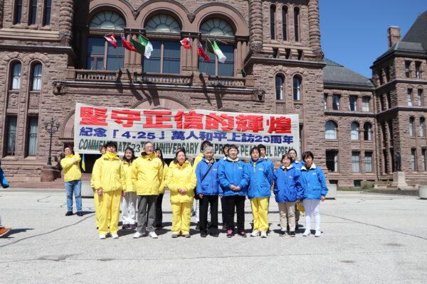  Falun Gong practitioners who participated in the appeal in Beijing on April 25, 1999, pose at the Ontario legislature on April 14, 2022, during a rally to commemorate the 23rd anniversary of the incident. (Michelle Hu/The Epoch Times)