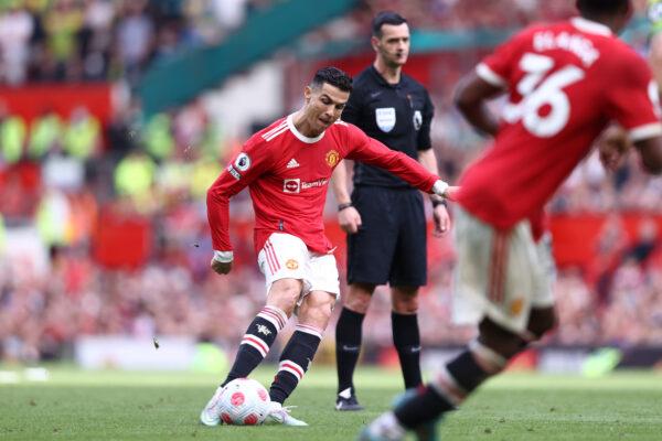 Cristiano Ronaldo of Manchester United scores their side's third goal and their hat-trick during the Premier League match between Manchester United and Norwich City at Old Trafford, in Manchester, England, on April 16, 2022. (Naomi Baker/Getty Images)