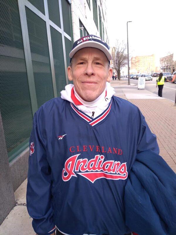 Former Cleveland Indians usher Mike Benezzi outside Cleveland's Progressive Field before the Guardians' inaugural home opener on April 15, 2022, Benezzi, 62, of Medina, Ohio, said he believes people won't mind the team's name change from Indians to Guardians if the team's owners create a winner. (Michael Sakal/The Epoch Times)