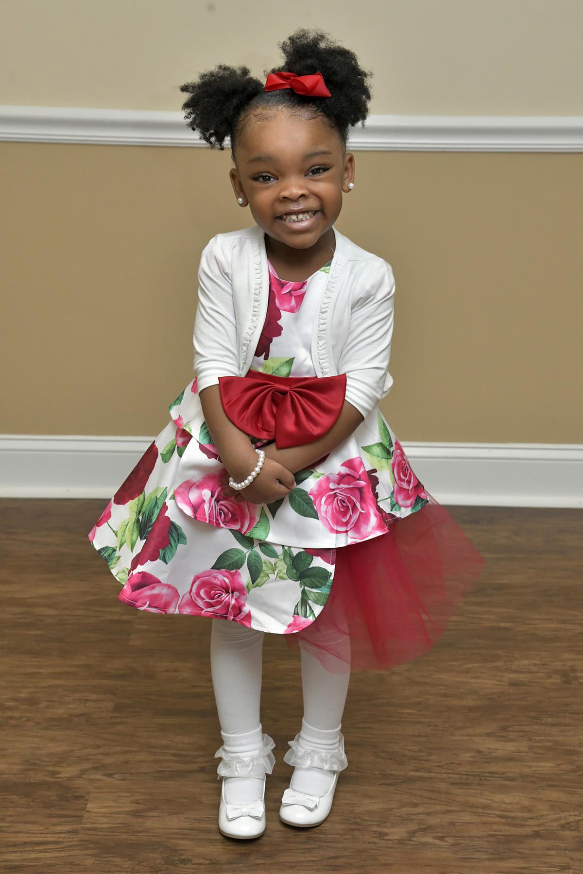 Zena Lee, 4, of Randallstown, attended Palm Sunday services with her mother, Nema Lee, at Rehoboth Ministries Church of God in Christ. Her mother said she has another special dress to wear on Easter. (Amy Davis /Baltimore Sun/TNS)