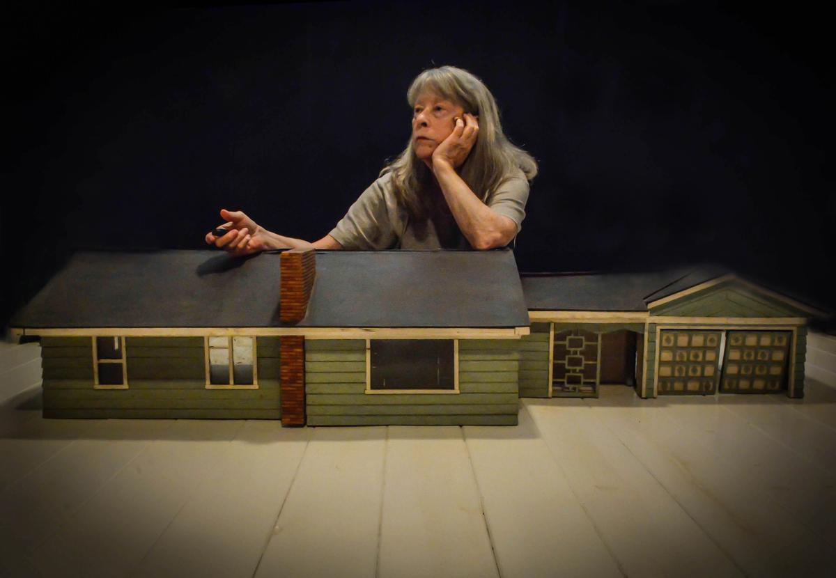 Penny Parrish in 2020 with a dollhouse replica of her childhood home. Her father and a friend built the family home in the early 1950s, and he later built the dollhouse for Parrish and her sister. She's now trying to find a home for the replica. (Courtesy Penny Parrish/TNS)