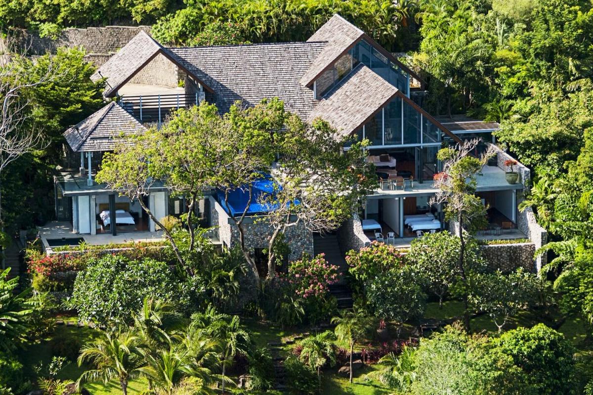 This West coast luxury oceanfront villa sits inside a plush canopy of pristine tropical vegetation overlooking the Patong coastline. (Courtesy of villa owners and Rosemont's)