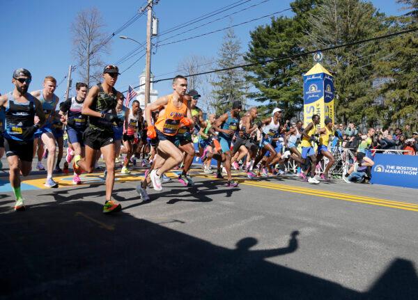 The elite men break from the starting line of the 126th Boston Marathon in Hopkinton, Mass., on April 18, 2022. (Mary Schwalm/AP Photo)