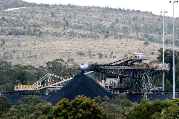This picture shows a conveyor bridge dumping soil and sand removed at another area of a coal mine in the town of Singleton, in Newcastle, Australia, on Nov. 5, 2021. (Saeed Khan/AFP via Getty Images)