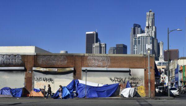 Tents housing the homeless line up in front of closed storefronts near downtown Los Angeles on Feb. 16, 2022. (Frederic J. Brown/AFP via Getty Images)