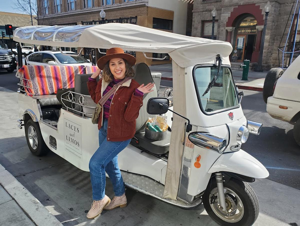 Millie Manaoat drives an electric tuk-tuk for Laces and Limos, which offers winery tours out of downtown Napa, California. (Sharyn Jackson/Minneapolis Star Tribune/TNS)