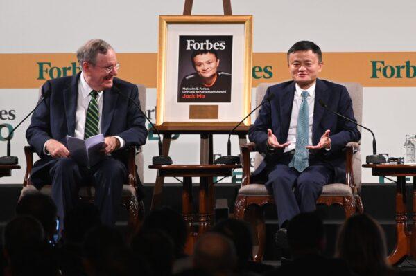 Jack Ma (R), co-founder and former executive chair of Alibaba Group, speaks next to Steve Forbes (L), chairman and editor-in-chief of Forbes media, during the Forbes Global CEO Conference in Singapore on Oct. 15, 2019. (Roslan Rahman/AFP via Getty Images)