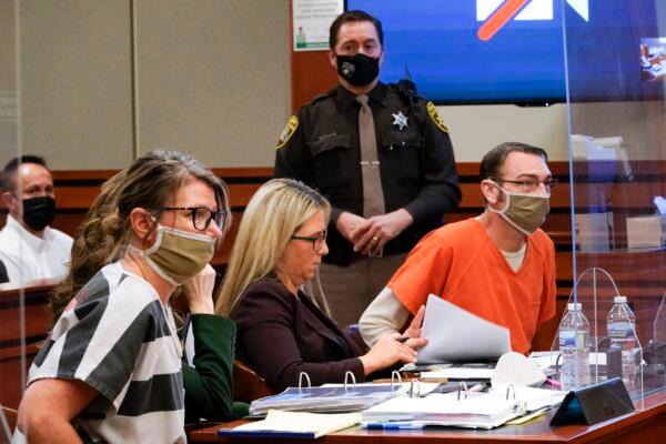 Jennifer Crumbley, (L), and James Crumbley, (R), the parents of Ethan Crumbley, a teenager accused of killing four students in a shooting at Oxford High School, appear in court for a preliminary examination on involuntary manslaughter charges in Rochester Hills, Mich. on Feb. 8, 2022. (Paul Sancya/AP Photo)