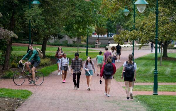 Students walk to and from classes on the Indiana University campus in Bloomington, Ind. on Oct. 14, 2021. (Darron Cummings/AP Photo)
