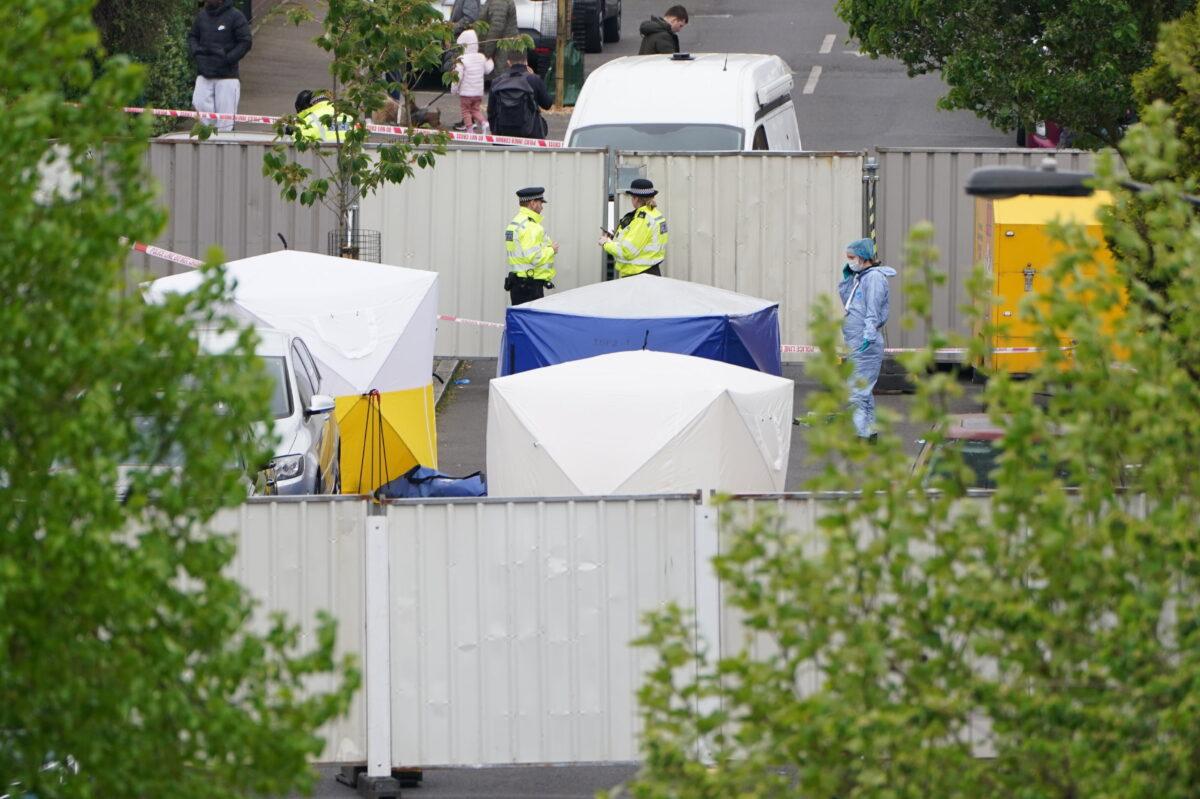 Police forensic tents outside a house where three women and a man were stabbed to death, in Bermondsey, southeast London, on April 25, 2022. (Kirsty O’Connor/PA Media)