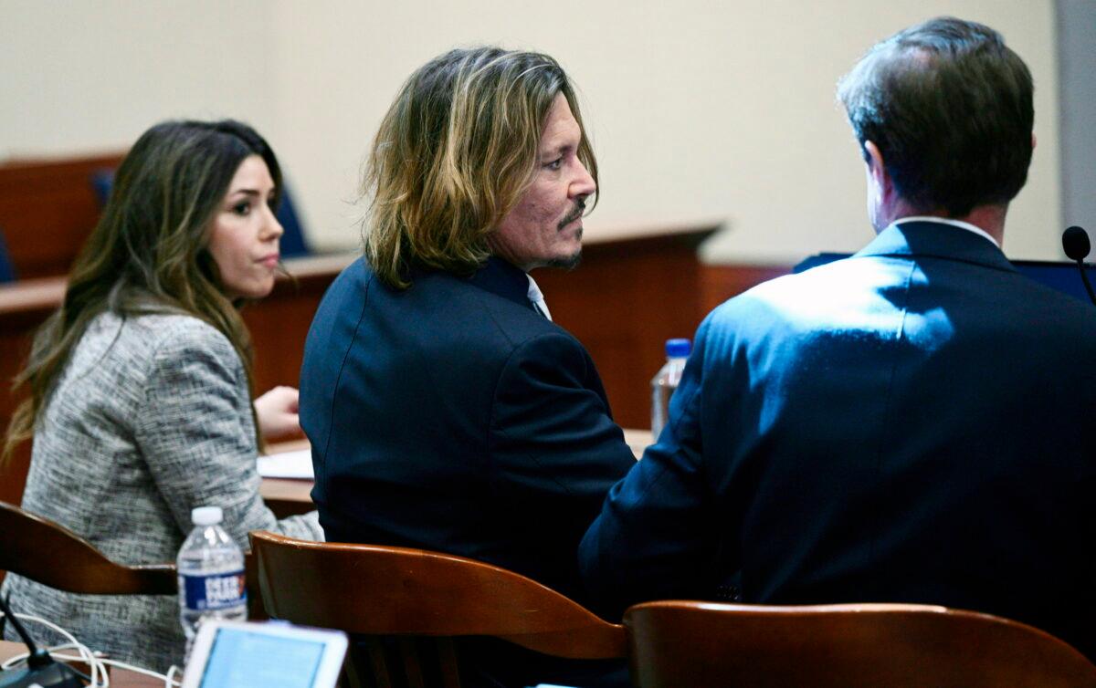 Actor Johnny Depp is seated inside the courtroom at the Fairfax County Circuit Court in Fairfax, Va., on April 12, 2022. (Brendan Smialowski/Pool via AP)