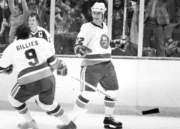 Mike Bossy of the New York Islanders (R) reacts after he scored the winning goal in overtime to beat the Toronto Maple Leafs 3–1 at the Nassau Coliseum in Uniondale, N.Y., on April 20, 1978. (Ray Stubblebine/AP Photo)