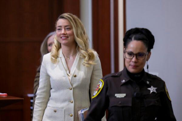Actress Amber Heard arrives at the courtroom for the Johnny Depp's defamation trial against her at the Fairfax County Circuit Courthouse in Fairfax, Va., on April 20, 2022. (Evelyn Hockstein/Pool via AP)