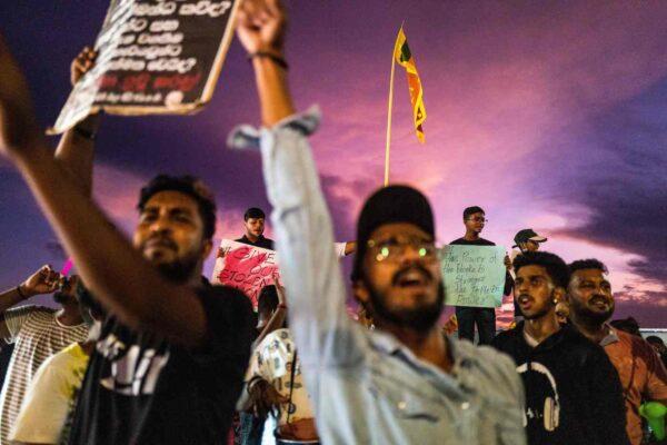 People shout slogans during an anti-government demonstration near the president's office in Colombo, Sri Lanka, on April 17, 2022. They are demanding that President Gotabaya Rajapaksa resign over the country's crippling economic crisis. (Jewel Samad/ AFP via Getty Images)