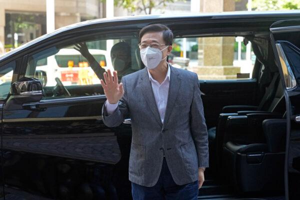 Former Hong Kong Chief Secretary John Lee arrives at his temporary office in Hong Kong on April 8, 2022. (Kin Cheung/AP Photo)