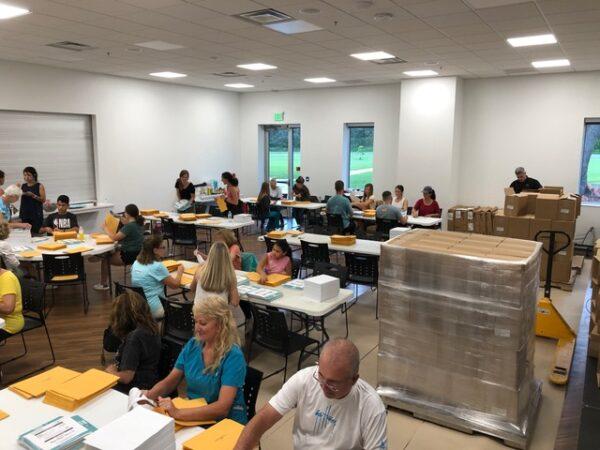 Volunteers with Protect Human Life Florida sort materials into packets to be used in the collection of signed petitions in Gainesville, Fla. on July 6, 2021. (Courtesy of Mark Minck)