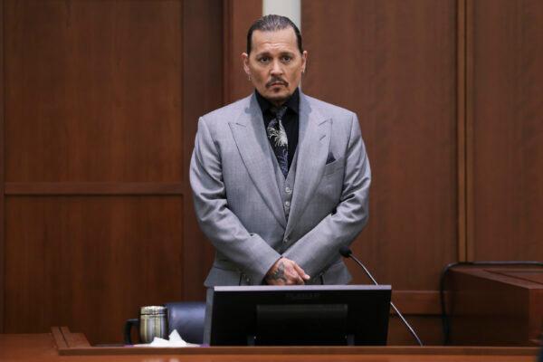Actor Johnny Depp takes a stand during his defamation trial against his ex-wife Amber Heard at the Fairfax County Circuit Courthouse in Fairfax, Va., on April 20, 2022. (Evelyn Hockstein/Pool via AP)