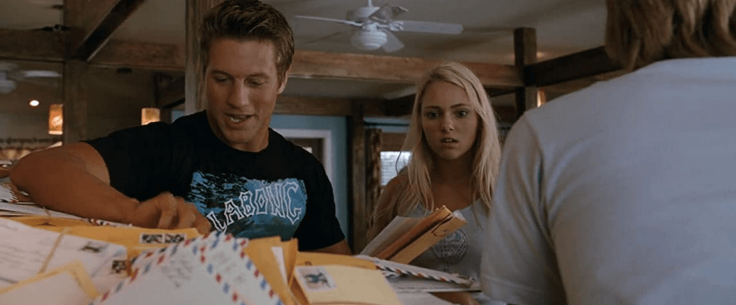 Noah Hamilton (Ross Thomas) and Bethany Hamilton (AnnaSophia Robb) dig through piles of fan mail, in "Soul Surfer." (Sony Pictures Releasing)