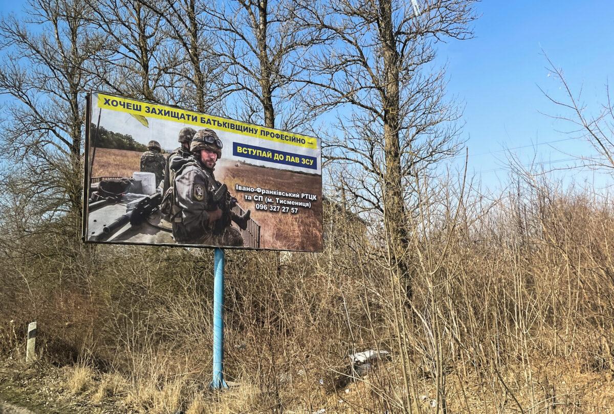 A roadside billboard states: "To protect your fatherland professionally, join the ranks of the Ukrainian Armed Forces," in western Ukraine, in March 2022. (Charlotte Cuthbertson/The Epoch Times)