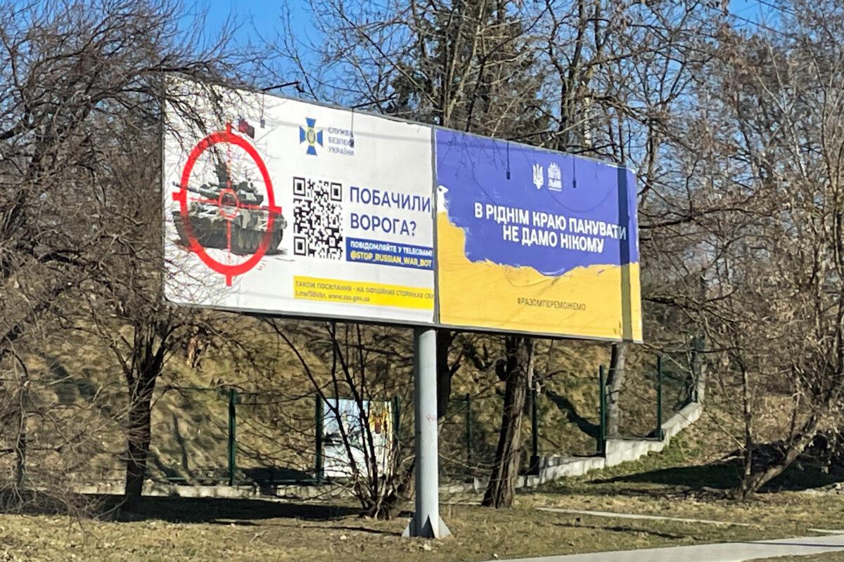 A billboard soliciting help from civilians includes a QR code that leads to a website where visitors can report the locations of Russian forces, in western Ukraine, in March 2022. (Charlotte Cuthbertson/The Epoch Times)