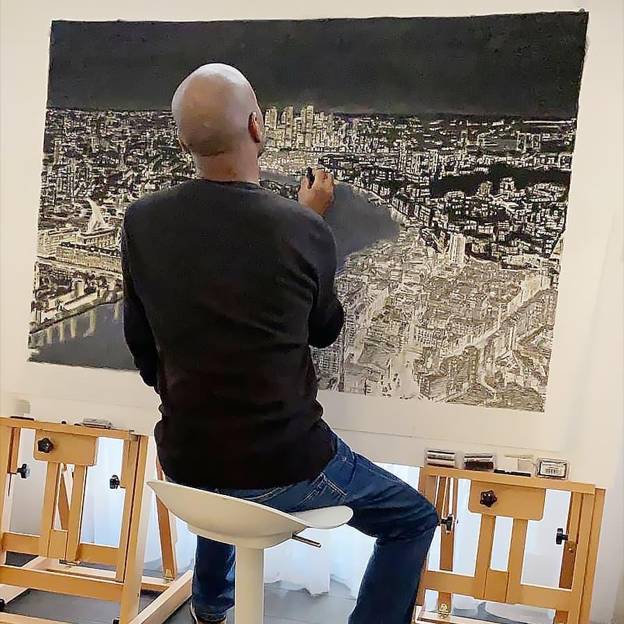 Stephen working on the drawing of his hometown. (Courtesy of Annette Wiltshire)