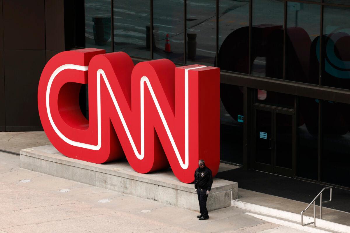 People walk by the world headquarters for the Cable News Network (CNN) in Atlanta on March 15, 2022. (Anna Moneymaker/Getty Images)
