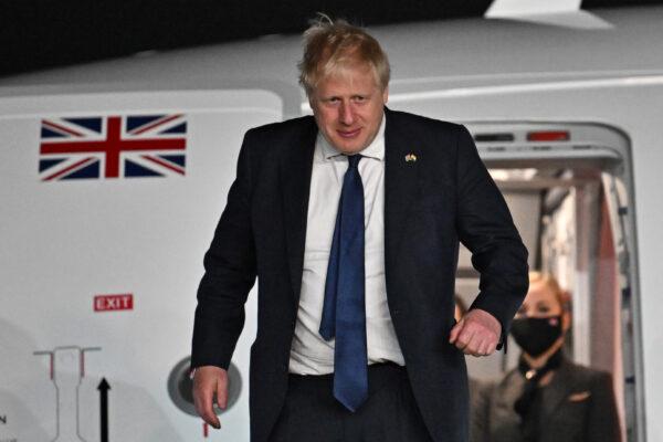 British Prime Minister Boris Johnson disembarks the plane having arrived at Indira Gandhi International Airport in New Delhi, India, on April 21, 2022. (Ben Stansall - WPA Pool/Getty Images)