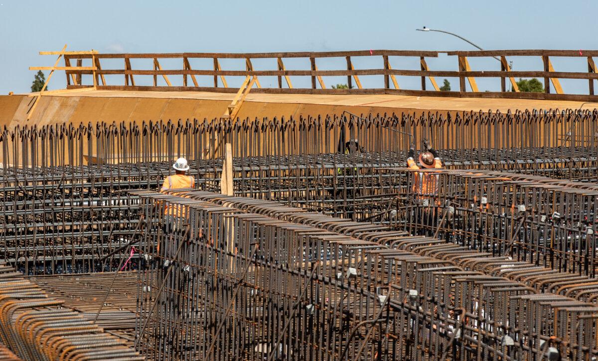Construction workers in Costa Mesa, Calif., on April 21. 2022. (John Fredricks/The Epoch Times)