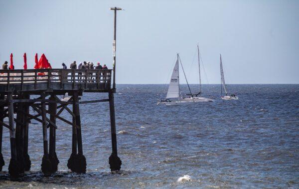 Sailors partake in the Newport to Ensenada International Yacht Race off the coast of Newport Beach, Calif., on April 22, 2022. (John Fredricks/The Epoch Times)