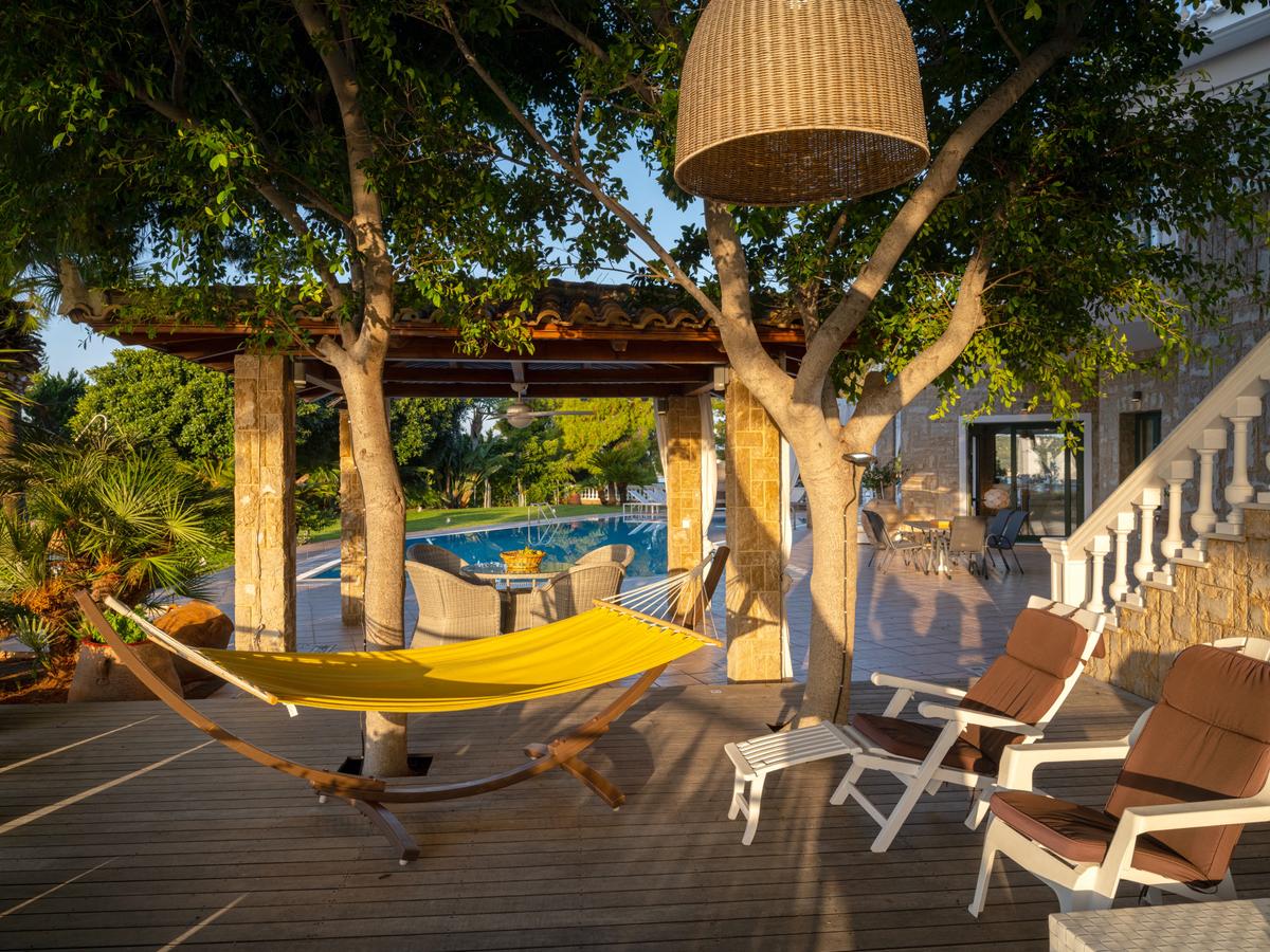 Outside, there are countless leisure nooks to take advantage of the wonderful natural surroundings and views. Alexander is, above all else, a place to relax and revel being in a slice of paradise. (Courtesy of Greece Sotheby's International Realty)