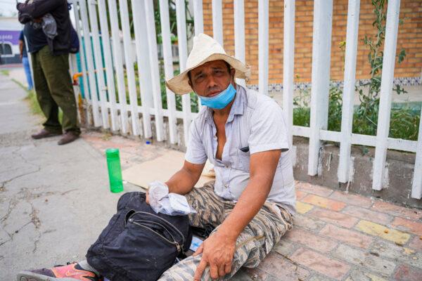 Franklin Novio Sosa from Nicaragua sits outside the Casa del Migrante shelter as he considers when to cross into the United States, in Piedras Negras, Mexico, on April 21, 2022. (Charlotte Cuthbertson/The Epoch Times)