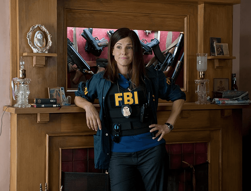 Agent Ashburn (Sandra Bullock) shows off her hidden arsenal, in "The Heat." (20th Century Fox)
