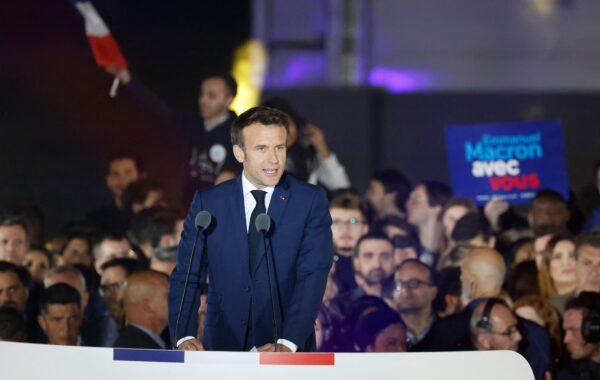French President and La Republique en Marche party candidate for reelection Emmanuel Macron celebrates after his victory in France's presidential election, at the Champ de Mars in Paris, on April 24, 2022. (Ludovic Marin/AFP via Getty Images)