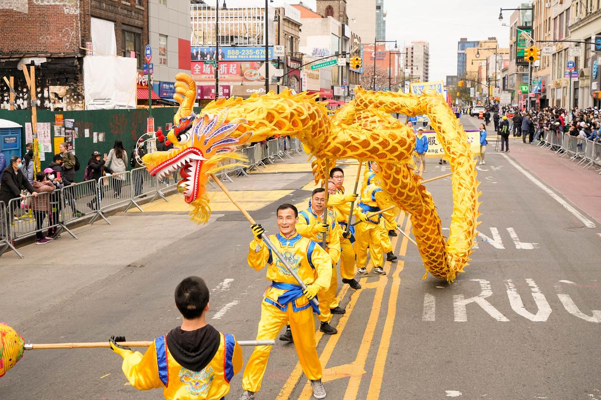 Falun Gong practitioners participate in a parade to commemorate the 23rd anniversary of the April 25th peaceful appeal in Beijing, in Flushing, N.Y., on April 23, 2022. (Larry Dye/The Epoch Times)
