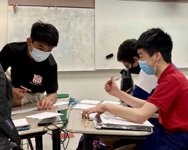 Daniel Wang (L), Abhinav Pothuri (C), and Emmanuel Zheng practice collaboration strategy for calculus problems in Gainesville, Fla. on April 14, 2021, in preparation for the team round of problem-solving at a national mathematics<br/>competition. (Courtesy of Himal Bamzai-Wokhlu)