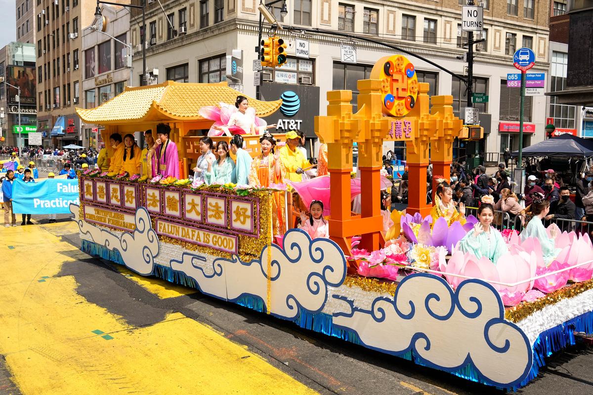 Falun Gong practitioners participate in a parade to commemorate the 23rd anniversary of the April 25th peaceful appeal in Beijing, in the Flushing neighborhood in New York, on April 23, 2022. (Larry Dye/The Epoch Times)