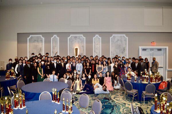 More than 90 members of Buchholz High School mathematics team and their coaches pose April 9, 2022, with the collection of trophies earned while winning the 2022 state championship of the Florida Association of Mu Alpha Theta in Orlando.<br/>(Courtesy of Himal Bamzai-Wokhlu)