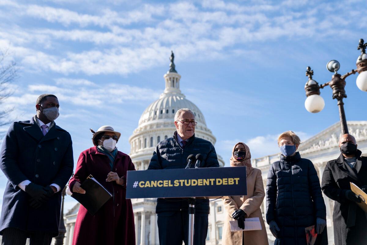 Senate Majority Leader Chuck Schumer (D-N.Y.) speaks during a press conference about student debt outside the U.S. Capitol in Washington on Feb. 4, 2021. Also pictured, L-R, Rep. Mondaire Jones (D-N.Y.), Rep. Alma Adams (D-N.C.), Rep. Ilhan Omar (D-Minn.), Sen. Elizabeth Warren (D-Mass.), and Rep. Ayanna Pressley (D-Mass.). The group of Democrats reintroduced their resolution calling on President Joe Biden to take executive action to cancel up to $50,000 in debt for federal student loan borrowers. (Drew Angerer/Getty Images)