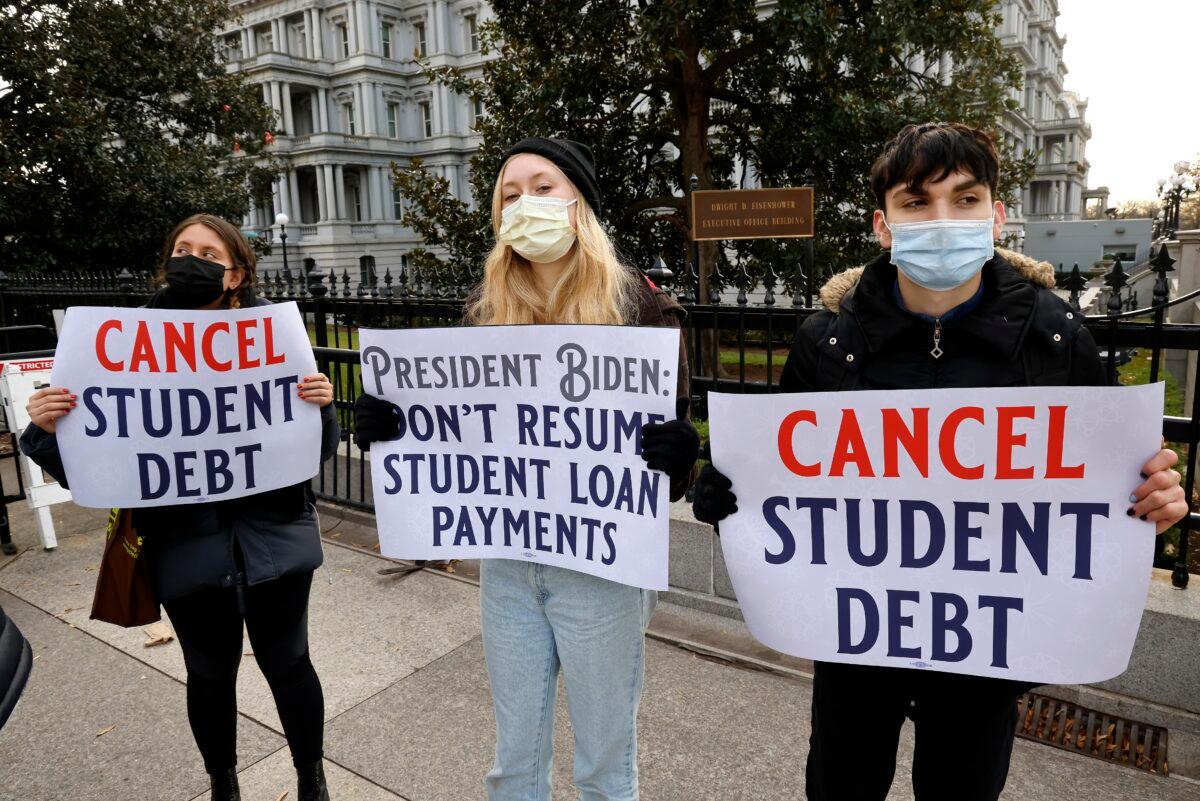 Activists call on President Joe Biden to not resume student loan payments in February and to cancel student debt near the White House in Washington on Dec. 15, 2021. (Paul Morigi/Getty Images for We, The 45 Million)