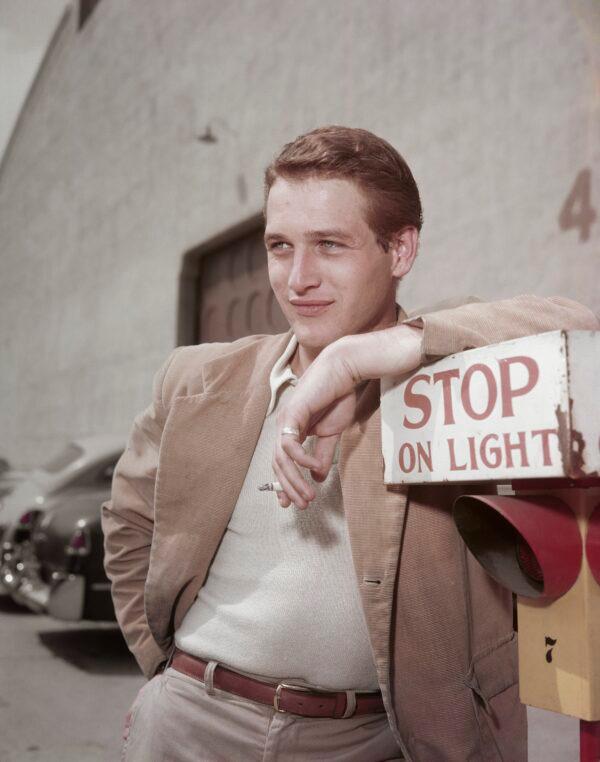 Paul Newman leans on a sign during the filming of<br/>“The Silver Chalice” in 1954. (Archive Photos/Getty Images)