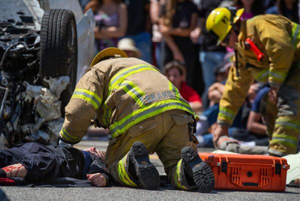 Students at Tesoro High School watch a mock DUI situation in Las Flores, Calif., on April 25, 2022. (John Fredricks/The Epoch Times)