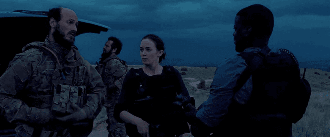 FBI agents Kate Macer (Emily Blunt, center) and Reggie Wayne (Daniel Kaluuya, R) teaming up with Delta Force operatives in the Mexican desert in "Sicario." (Richard Foreman Jr/Lionsgate)