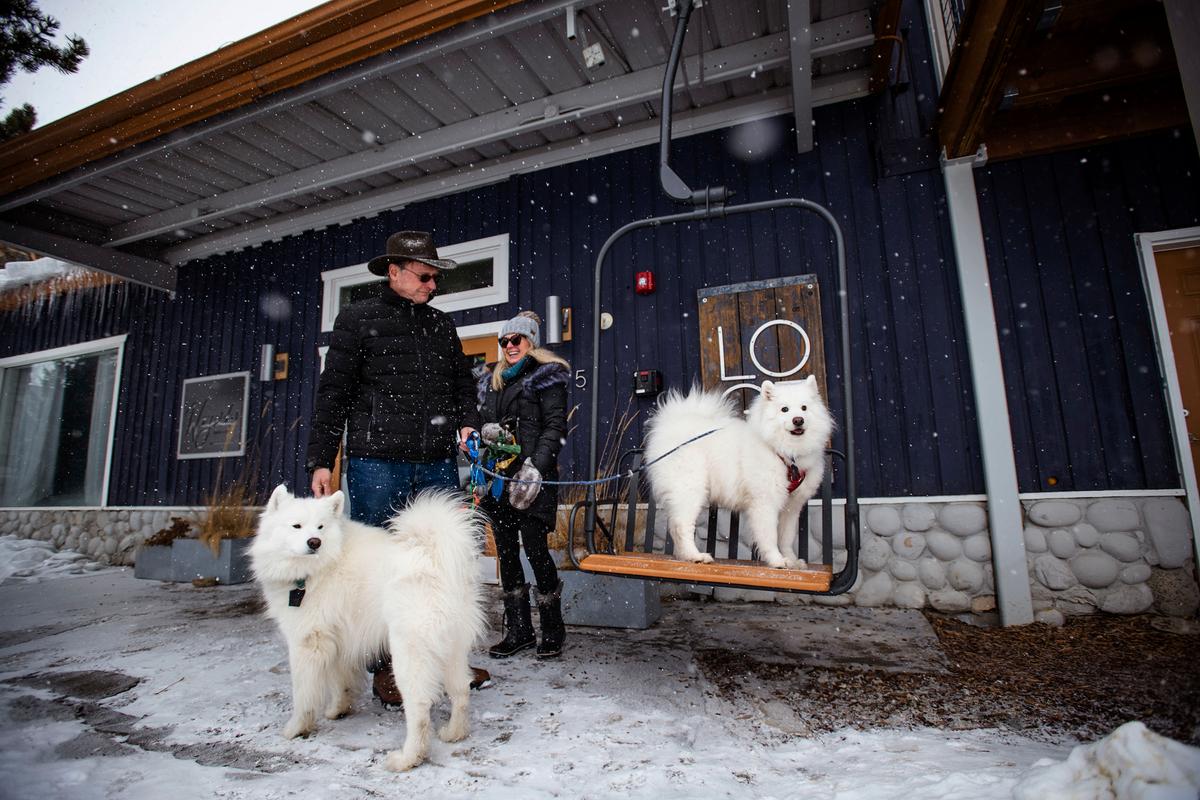 John and Barbara Stafford, from Highlands Ranch, Colorado, hang with their dogs Yeti and Cassie outside the LOGE in Breckenridge, Colorado, on March 9, 2022. (Chancey Bush/Colorado Springs Gazette/TNS)