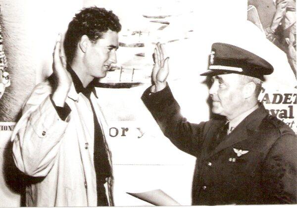 Ted Williams being sworn into the military on May 22, 1942. (Public Domain)